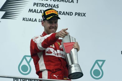 Vettel stuns Mercedes with Ferrari win at Sepang! Vettel stuns Mercedes with Ferrari win at Sepang!